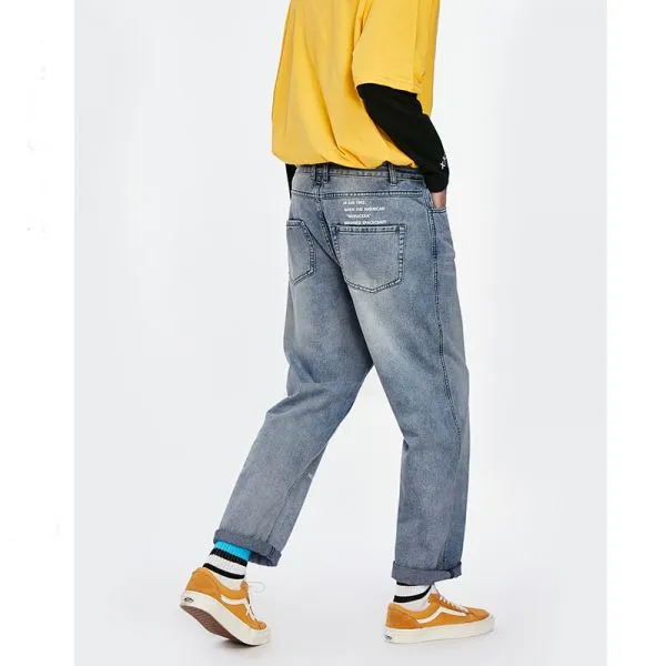 Straight leg jeans in mid wash blue for men