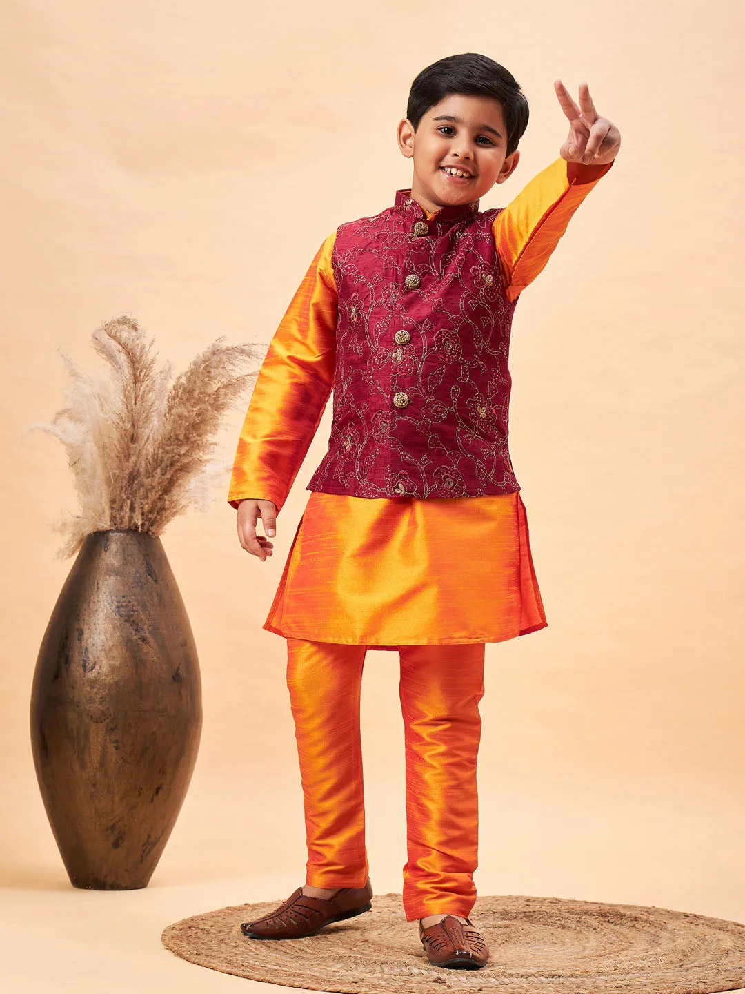 VASTRAMAY Boy's Maroon Nehru Jacket With Orange Kurta And Pyjama Set